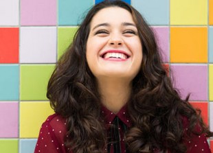 1000-happy-woman-on-colorful-background.jpg