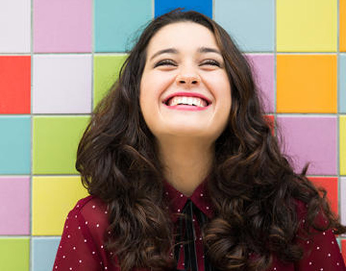1000 happy woman on colorful background.jpg